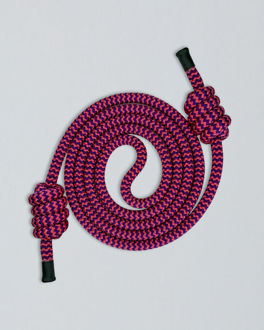 Pink and purple braided rope with a knot and black end caps on a light gray background
